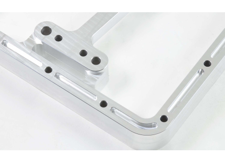 Oil sump extension with rear external filter