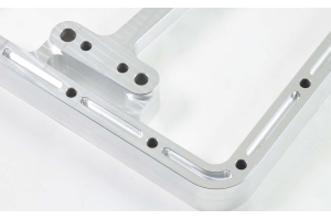 Oil sump extension with rear external filter